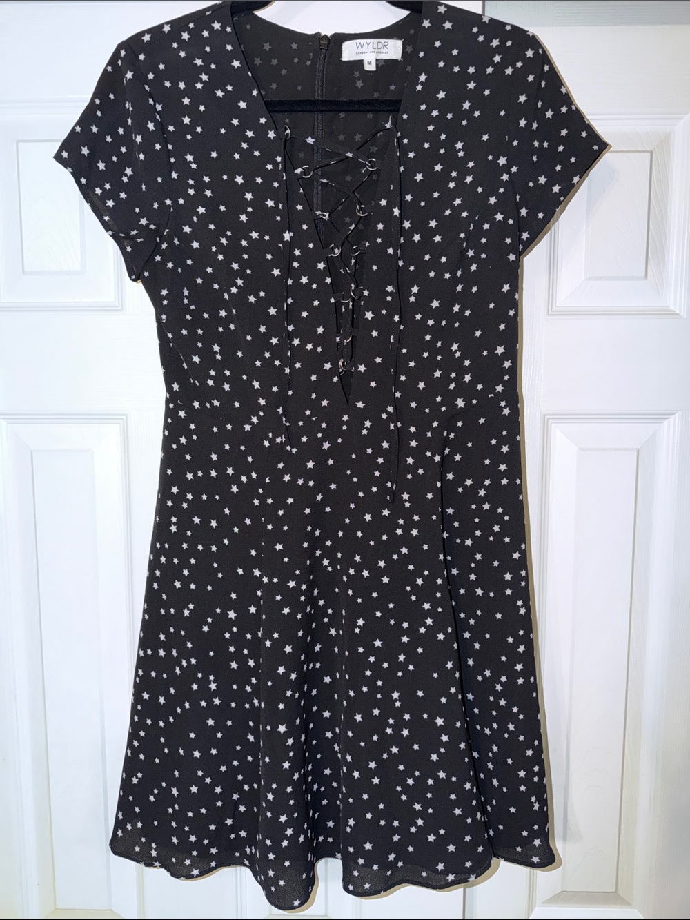 WYLDR Black Mini Dress with White Star Print & Lace-Up Neck